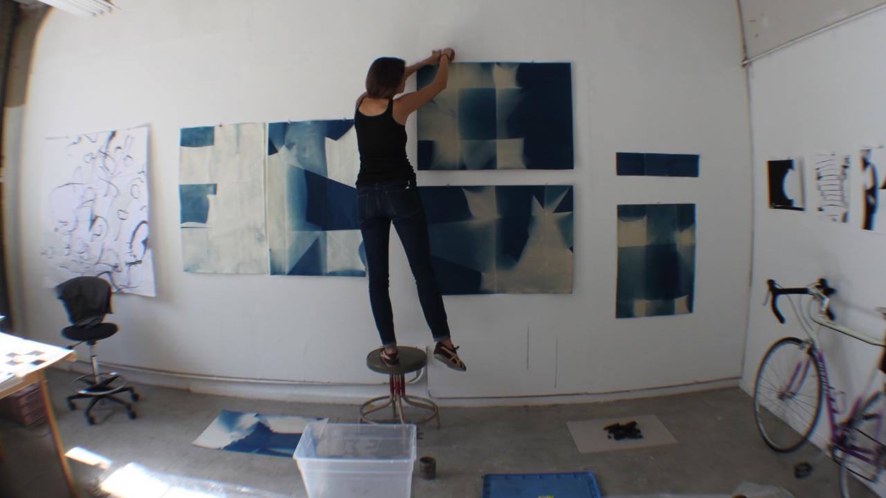 Image of student installing master's degree show at Manetti Shrem Museum