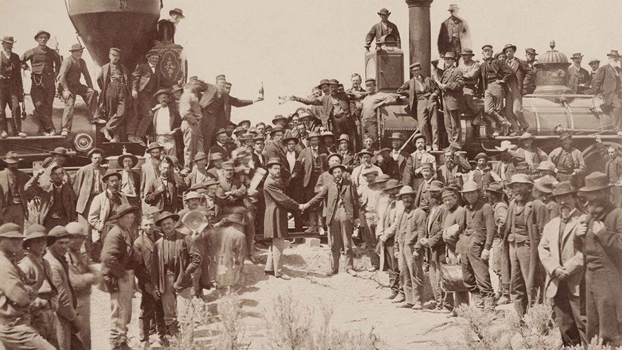 historic photo of last spike ceremony for transcontinental railroad